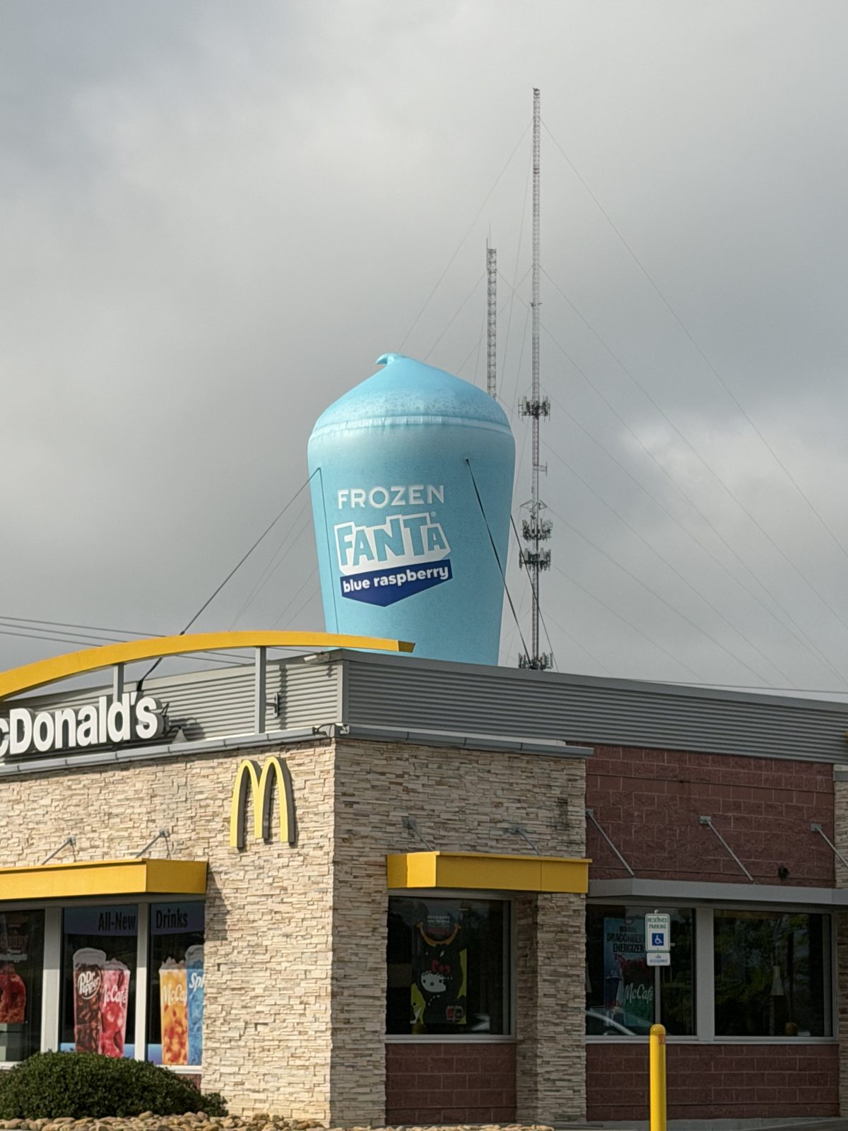 Inflatable Frozen Fanta cup replica on a McDonald's rooftop