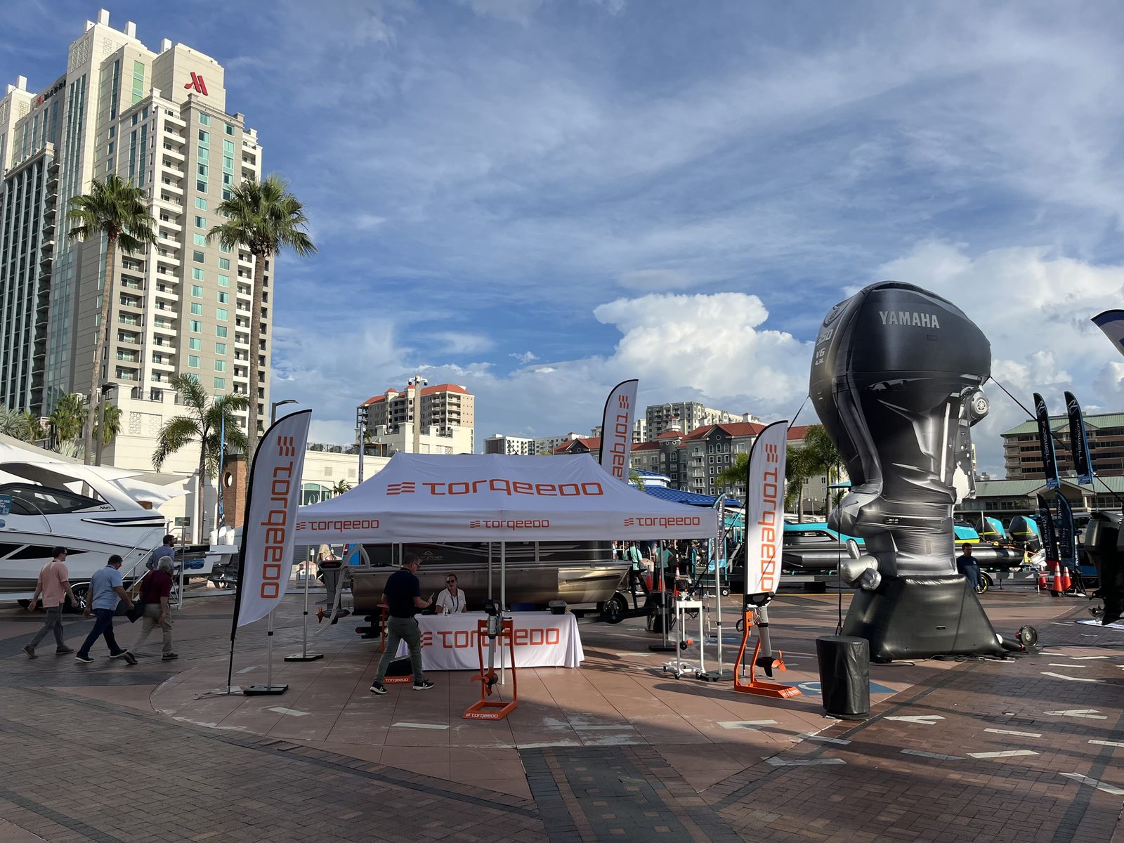 Photorealistic inflatable Yamaha outboard replica at an outdoor boat show