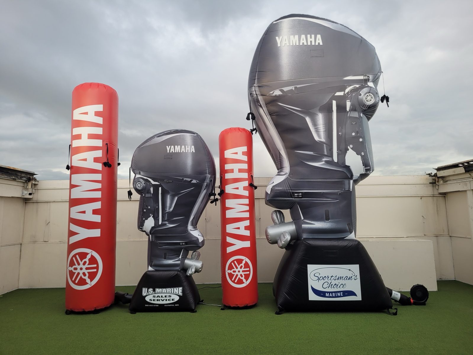 Photorealistic inflatable Yamaha outboard engine replicas with branded columns